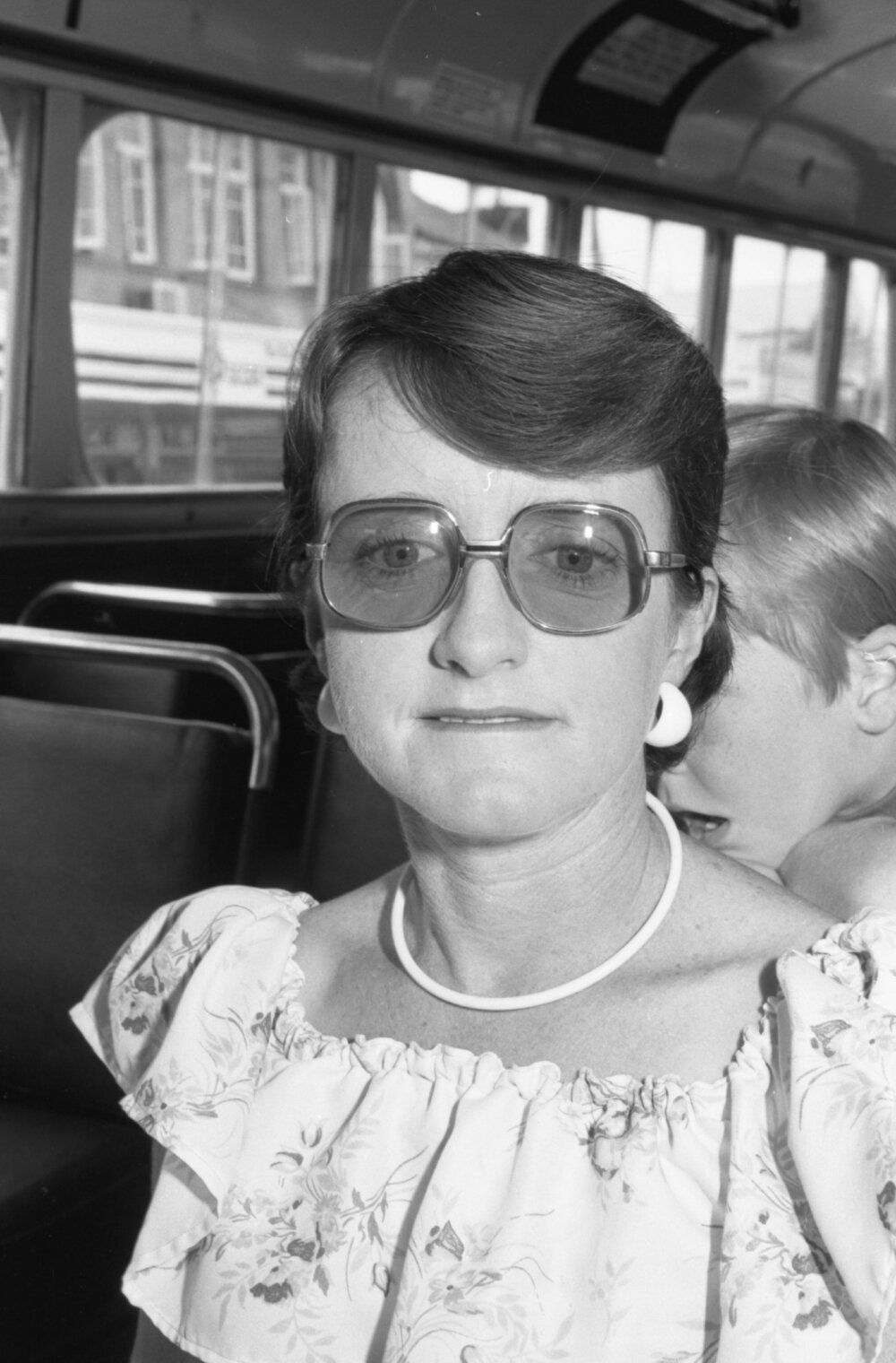 An unidentified woman on a bus, Ipswich, December 1977