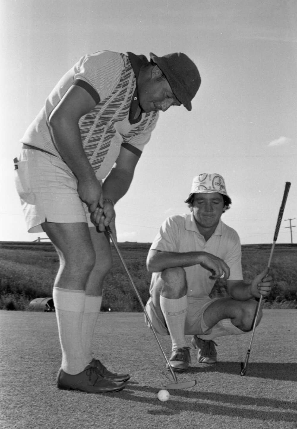 Two golfers at a golf course, Ipswich, Queensland, January 1978