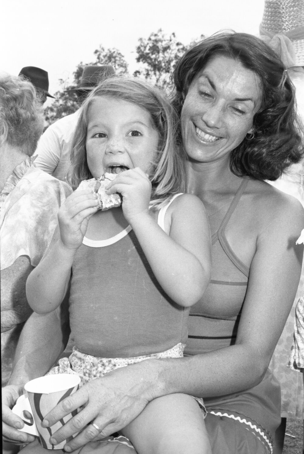 Woman and little girl having lunch at the Grandchester State School centenary celebration, Grandchester, Ipswich, January 1978