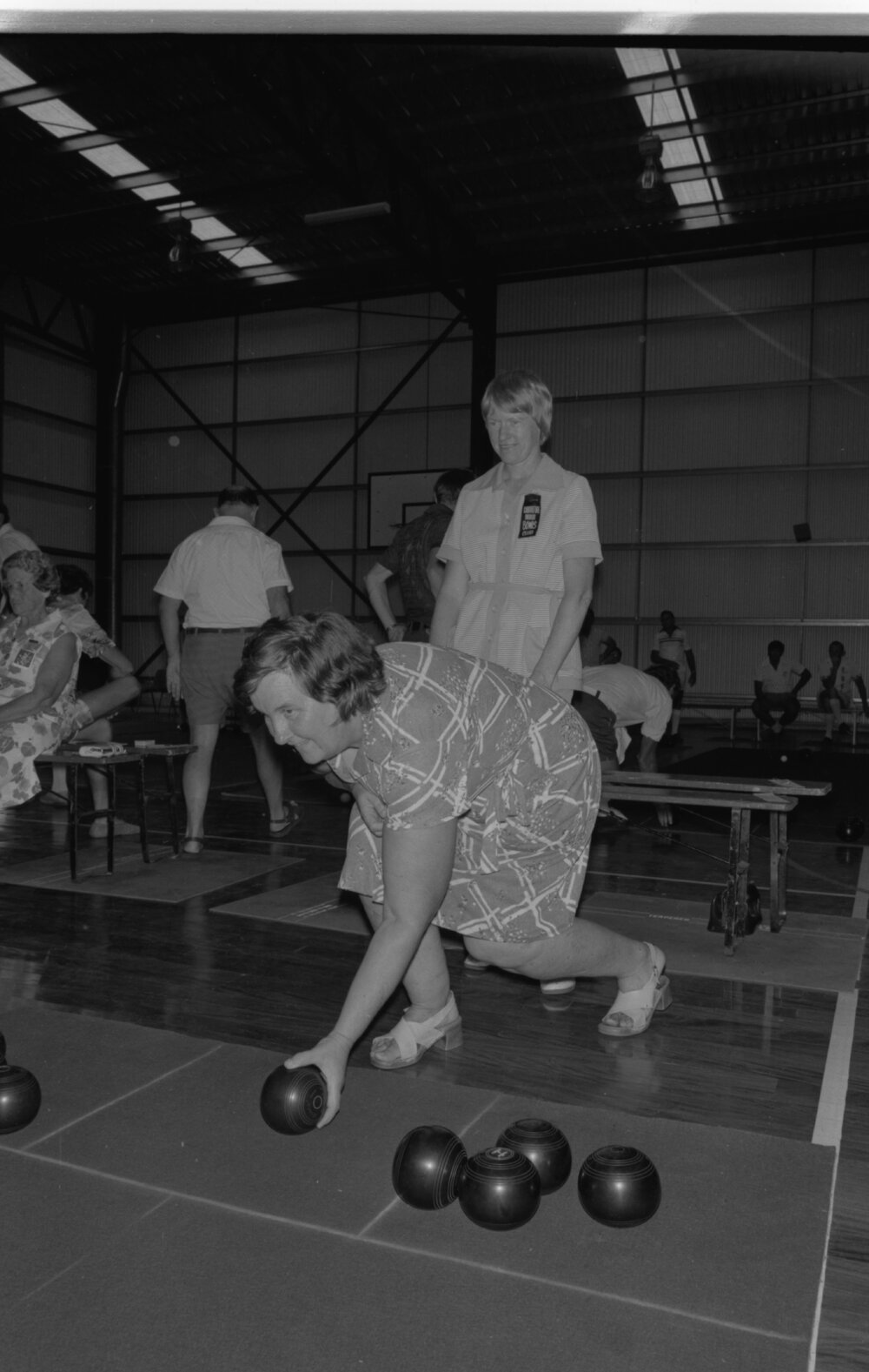 Women playing bowls in a gym, Ipswich, January 1978