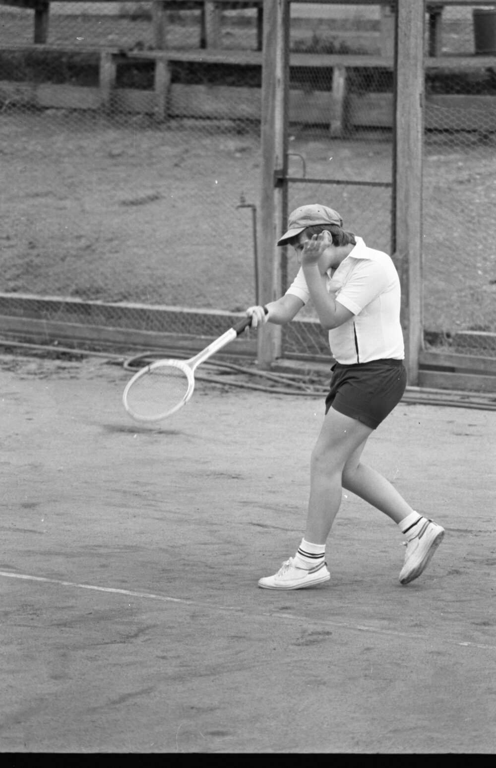 Man playing tennis, Ipswich, January 1978