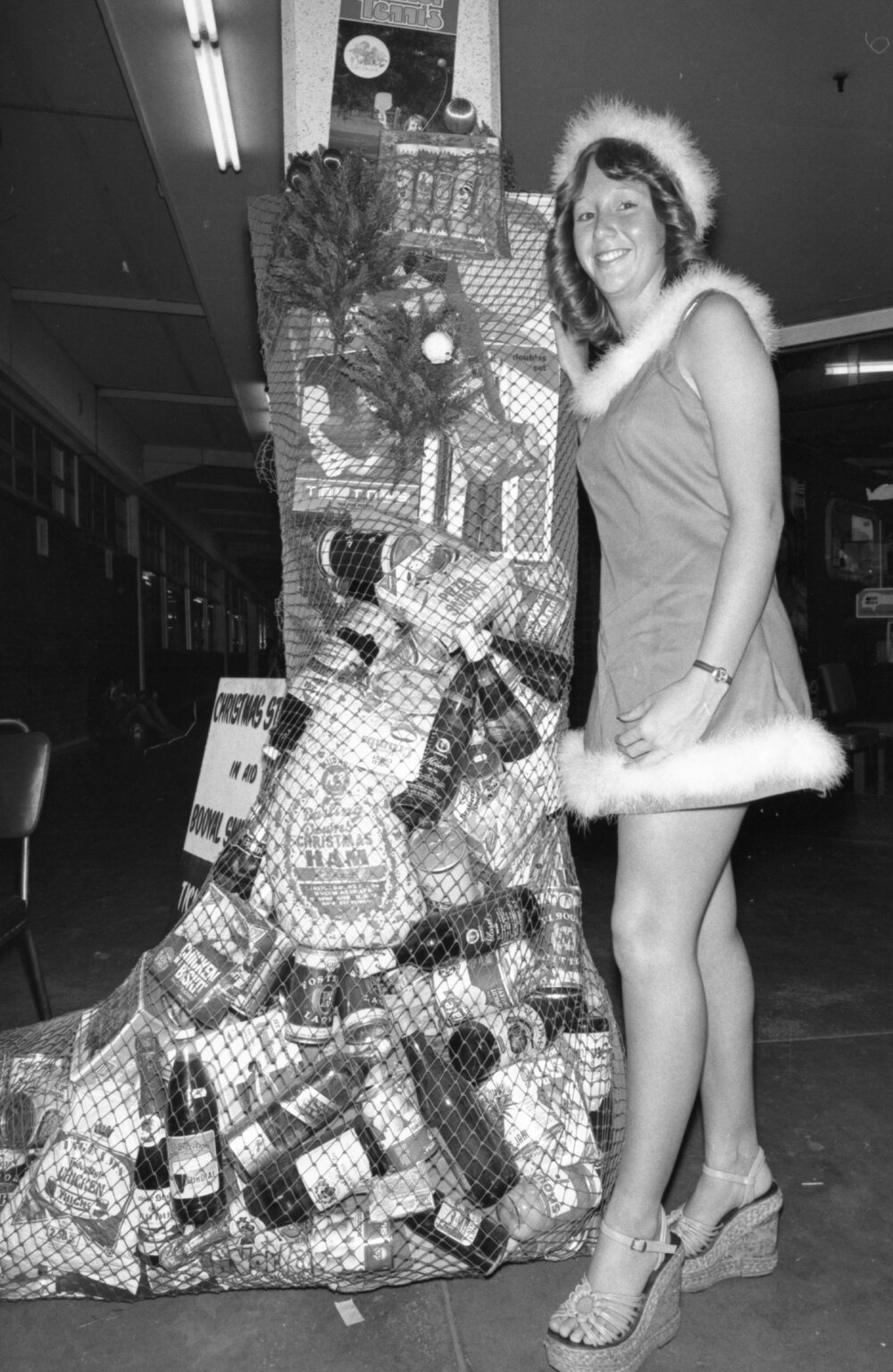 Anita Mitchen posing with a stocking full of donations for Christmas, Ipswich, December 1977