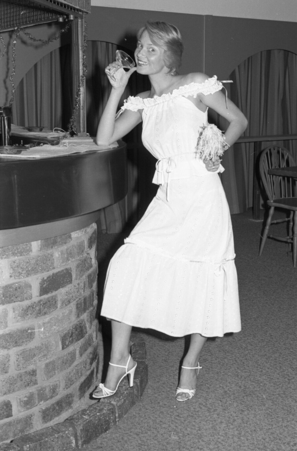 Model advertising dresses for end of year celebrations, Ipswich, December 1977
