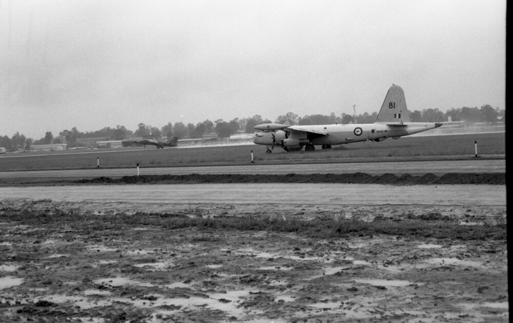Royal Australian Air Force Lockheed SP-2H Neptune MR4 and F-111E Aardvark on RAAF Base Amberley Runway, Amberley, Ipswich, February 1978