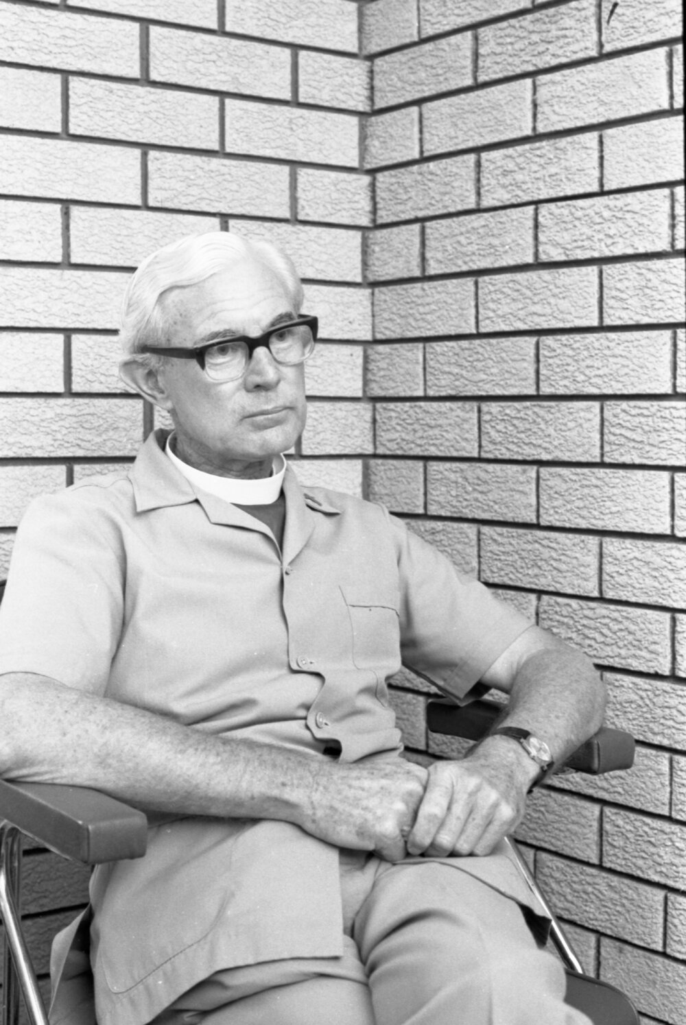 Unidentified bishop wearing glasses and pale safari suit, Ipswich, February 1978