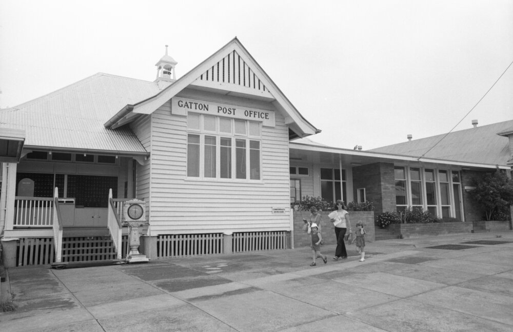 Unidentified people visiting the Gatton Post Office, Gatton, Lockyer Valley, February 1978