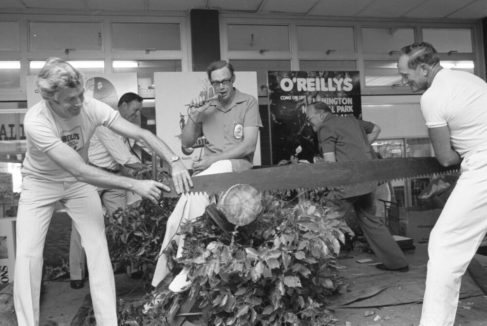 Unidentified MC overseeing long saw demonstration with Mayor Hastings at Booval fair, Booval, Ipswich, February 1978