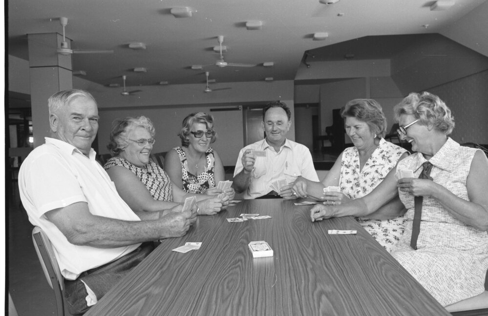 Unidentified group of people playing a card game, Ipswich, Queensland, February 1978