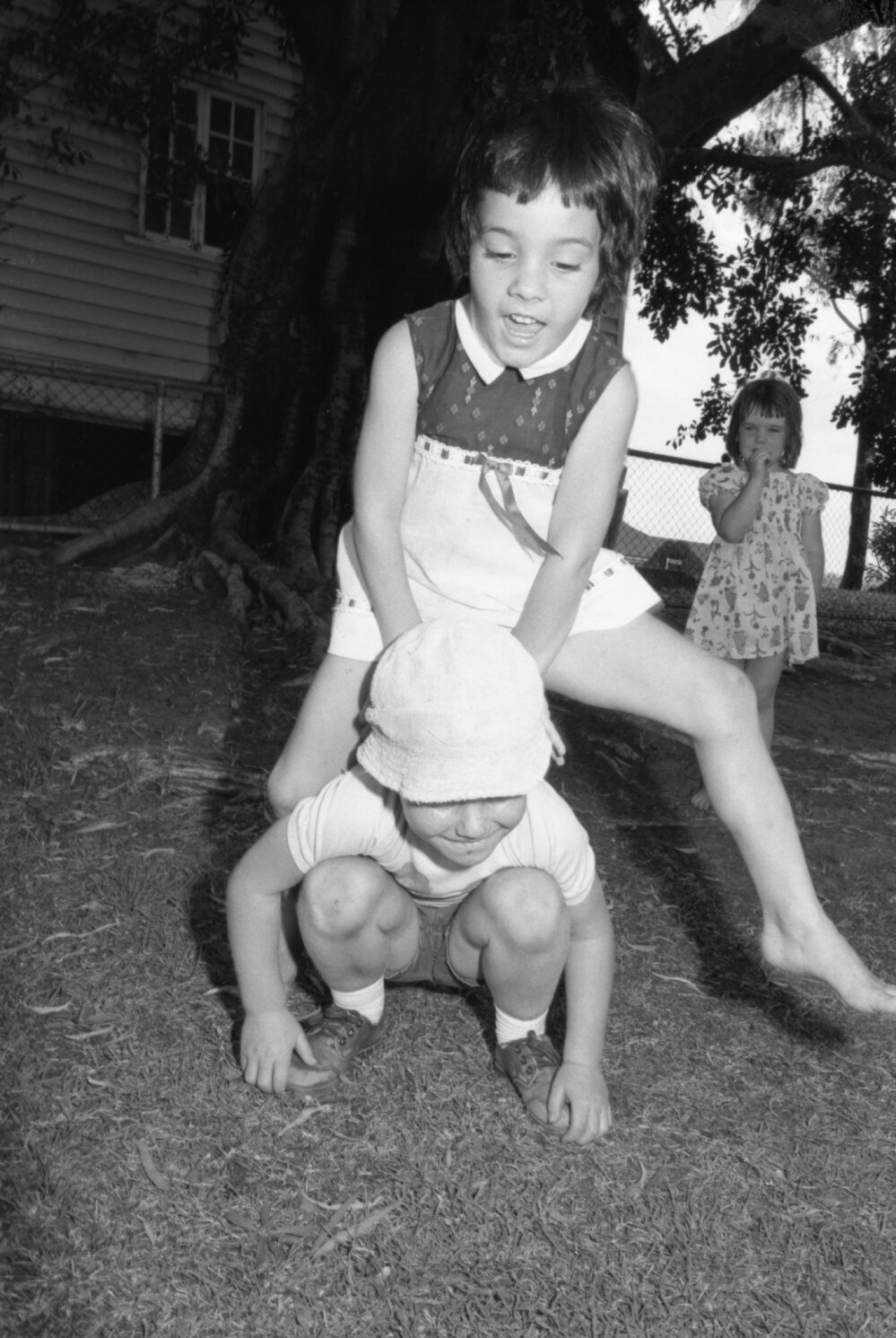 Kids playing leapfrog, Ipswich, November 1977