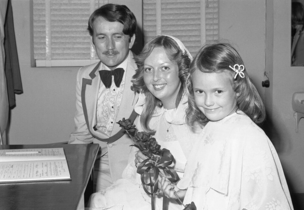 Newlyweds with their flower girl, Ipswich, November 1977