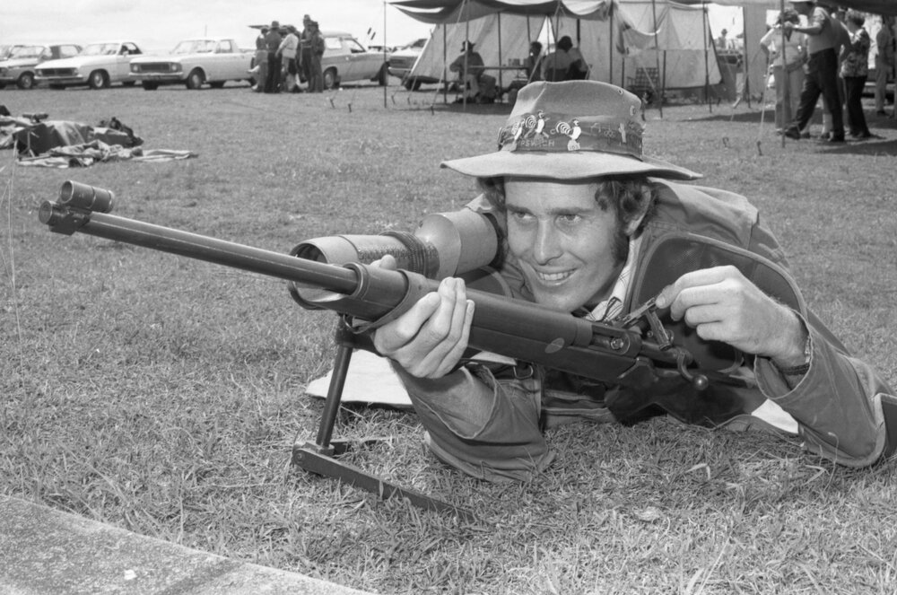 Man with firearm, Redbank Rifle Range, Redbank, February 1978