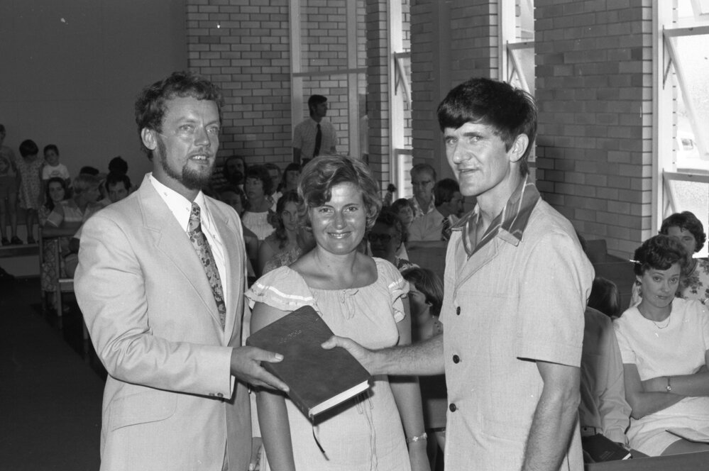 Pastor John Nicolle with man and woman in a church, Ipswich, February 1978