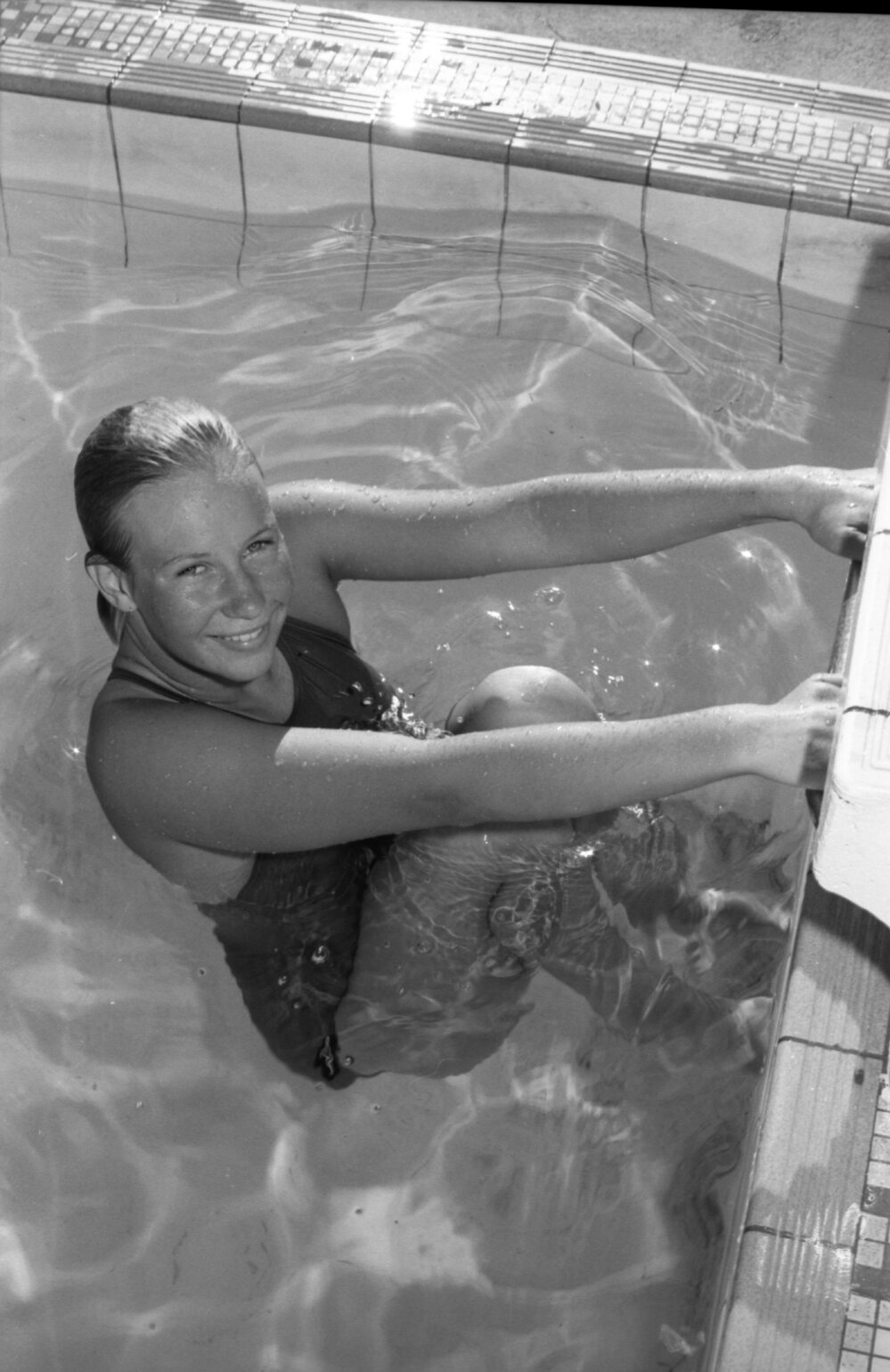 Young woman in swimwear at a pool, Ipswich, February 1978