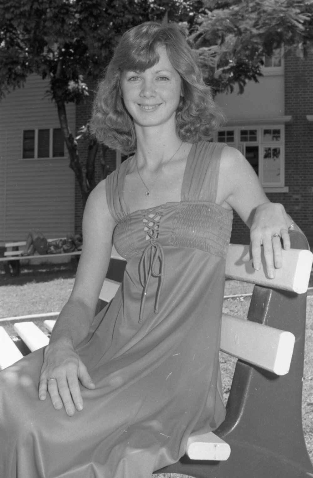 Unidentified young woman posing in Memorial Gardens, Ipswich, February 1978