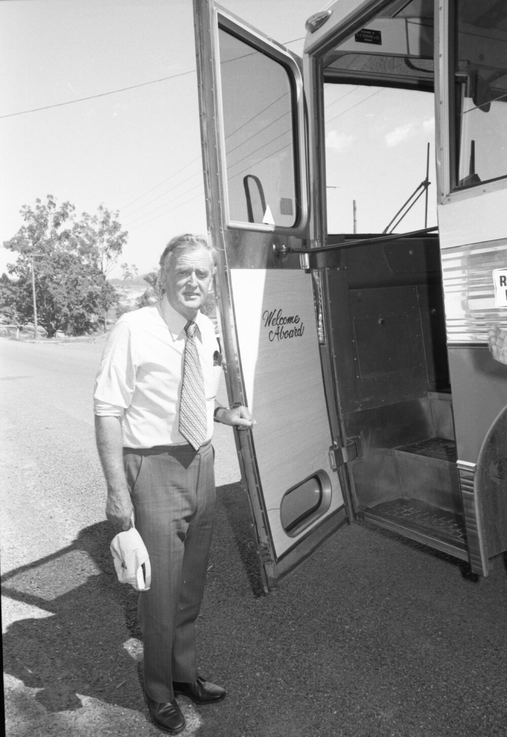 Joh Bjelke-Petersen with bus at location of Wivenhoe Dam during construction, Somerset, Queensland, February 1978