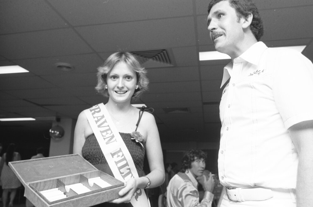 Unidentified cigarette girl and man in the Palais Royal Hotel for the Country Music Talent Quest program, Ipswich, Queensland, February 1978