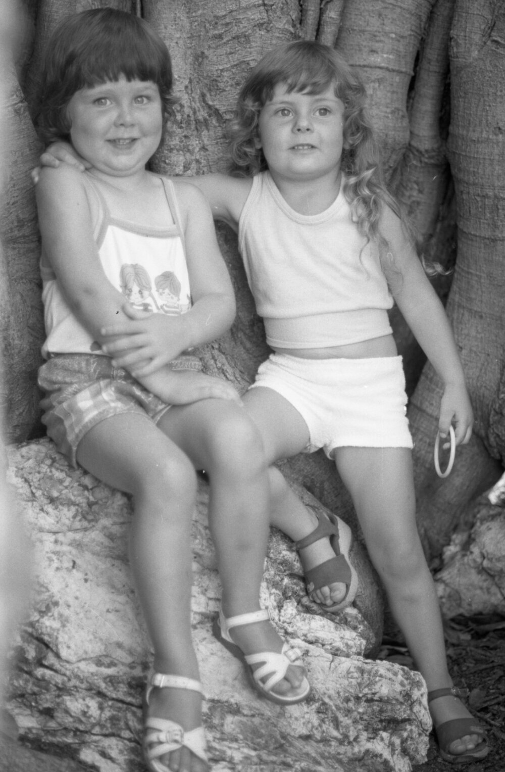 Two unidentified children under a Moreton Bay Fig Tree at Queens Park, Ipswich, February 1978