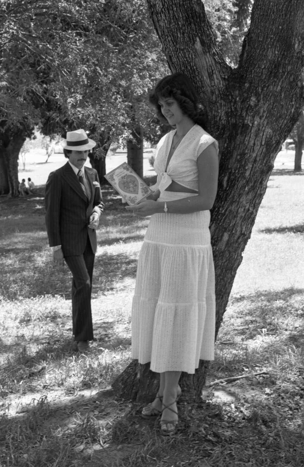 Unidentified man and woman in Queens Park taking Valentine's Day photos, Ipswich, February 1978