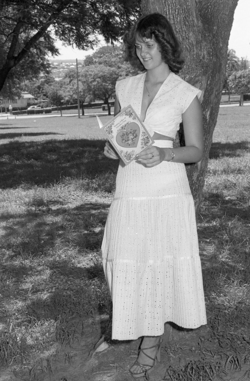 Unidentified woman posing with Valentine's Day card in Queens Park, Ipswich, February 1978