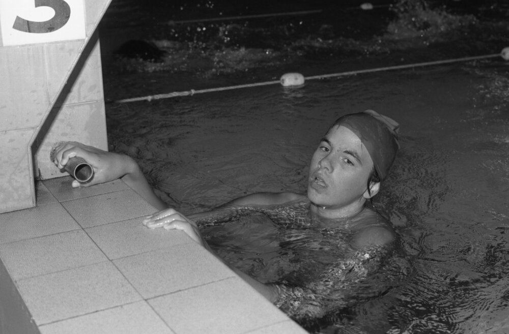 Unidentified swimmer at a starting block, Ipswich, Queensland, February 1978