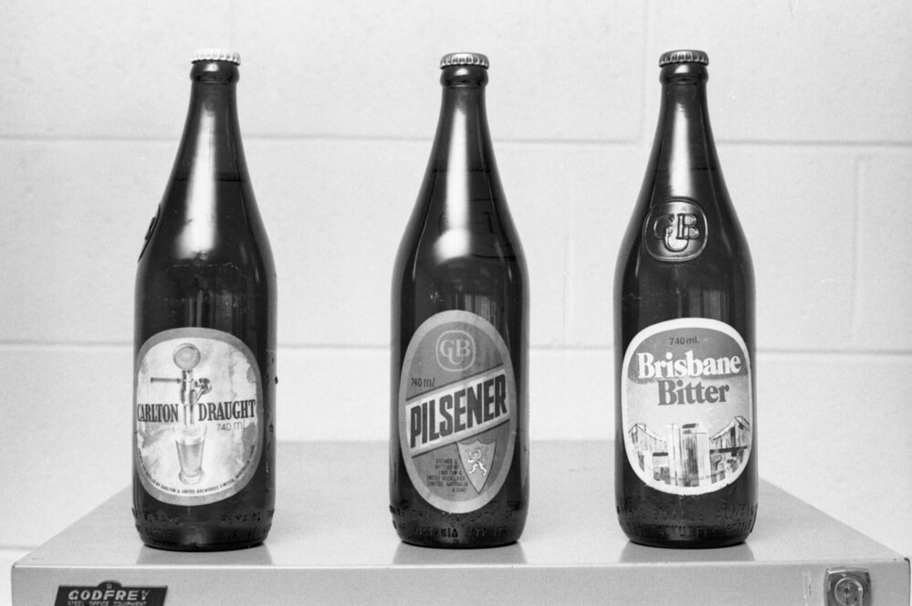 Bottles of Carlton Draught, Pilsener, and Brisbane Bitter drinks photographed for advertisements in the Queensland Times, Ipswich, Queensland, February 1978