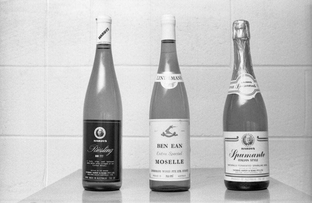 Bottles of Hardy's Reisling, Ben Ean Moselle, and Hardy's Spumante, photographed for advertisements in the Queensland Times, Ipswich, Queensland, February 1978