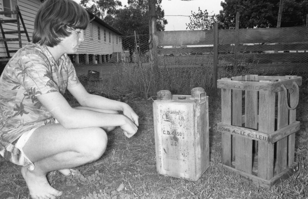 Boy with an explosives canister, Ipswich, November 1977
