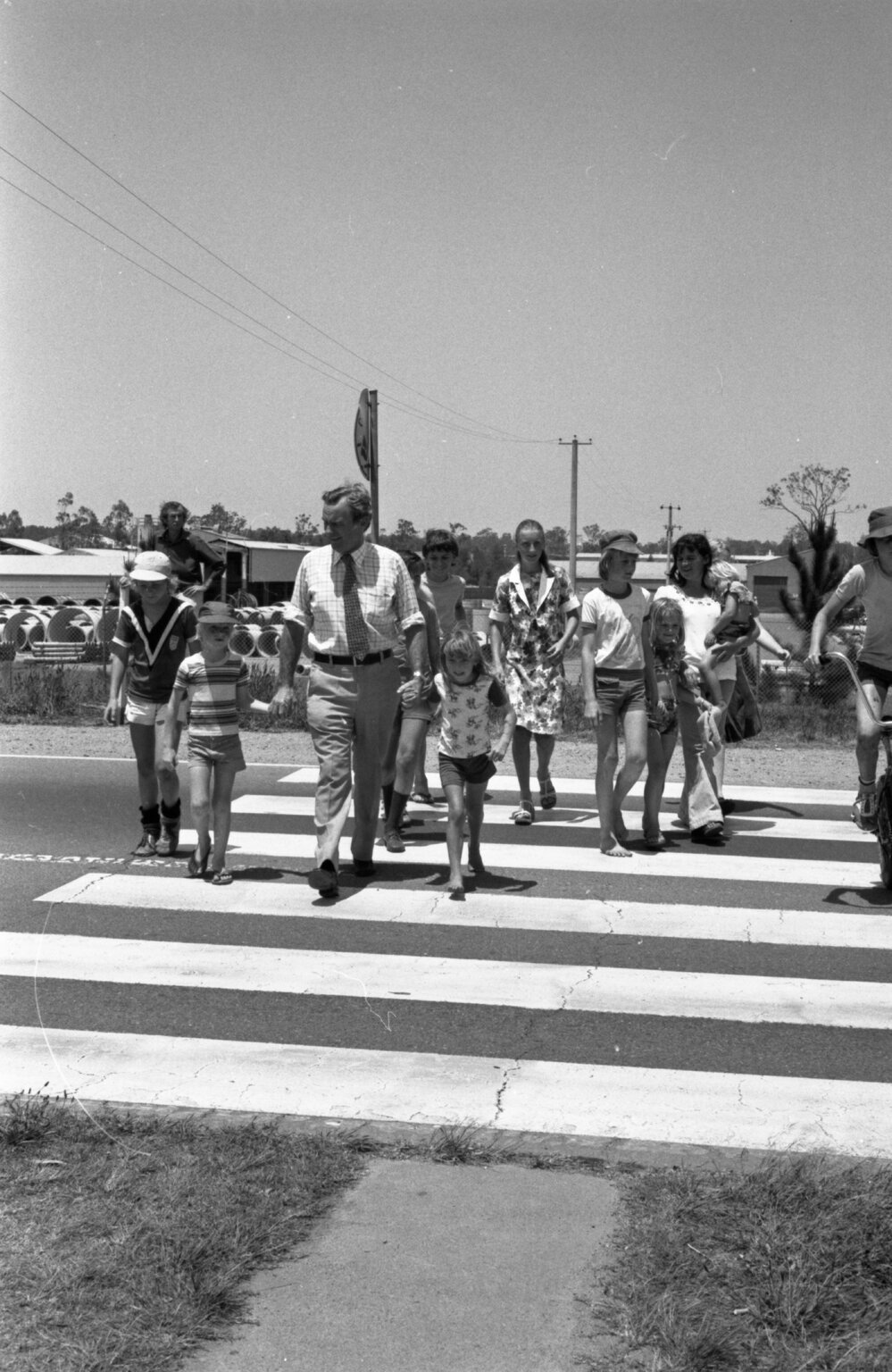 Bill Hayden helping kids cross the road, Ipswich, November 1977