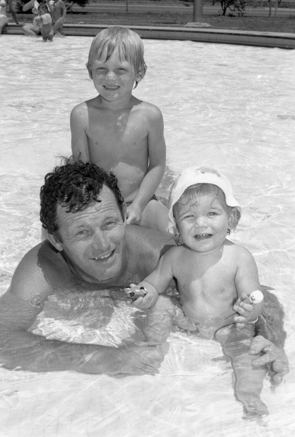 Father swimming with his kids, Bundamba, November 1977