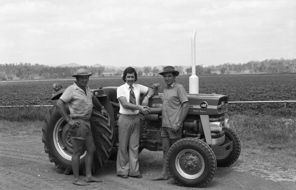 David Beduhn, of Keidge Motors, with farmers John and Pat Keller, Lowood, November 1977