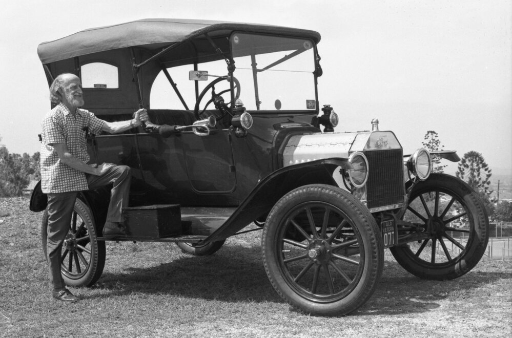 Unidentified man with vintage Ford Model T, Ipswich, November 1977