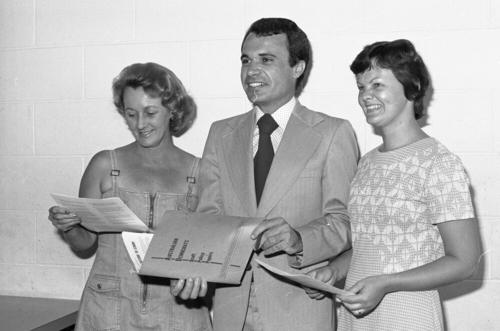 Two unidentified women with Australian Democrat Senate Candidate Paul Griffin, Ipswich, November 1977