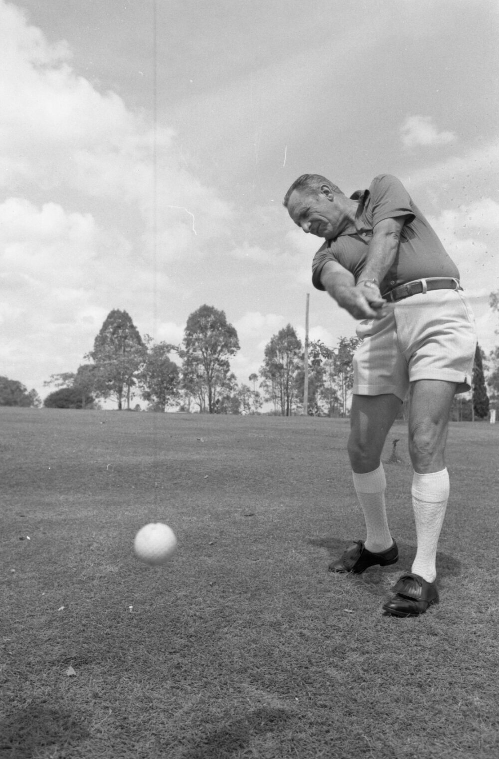 Man hitting golf ball, Ipswich, November 1977