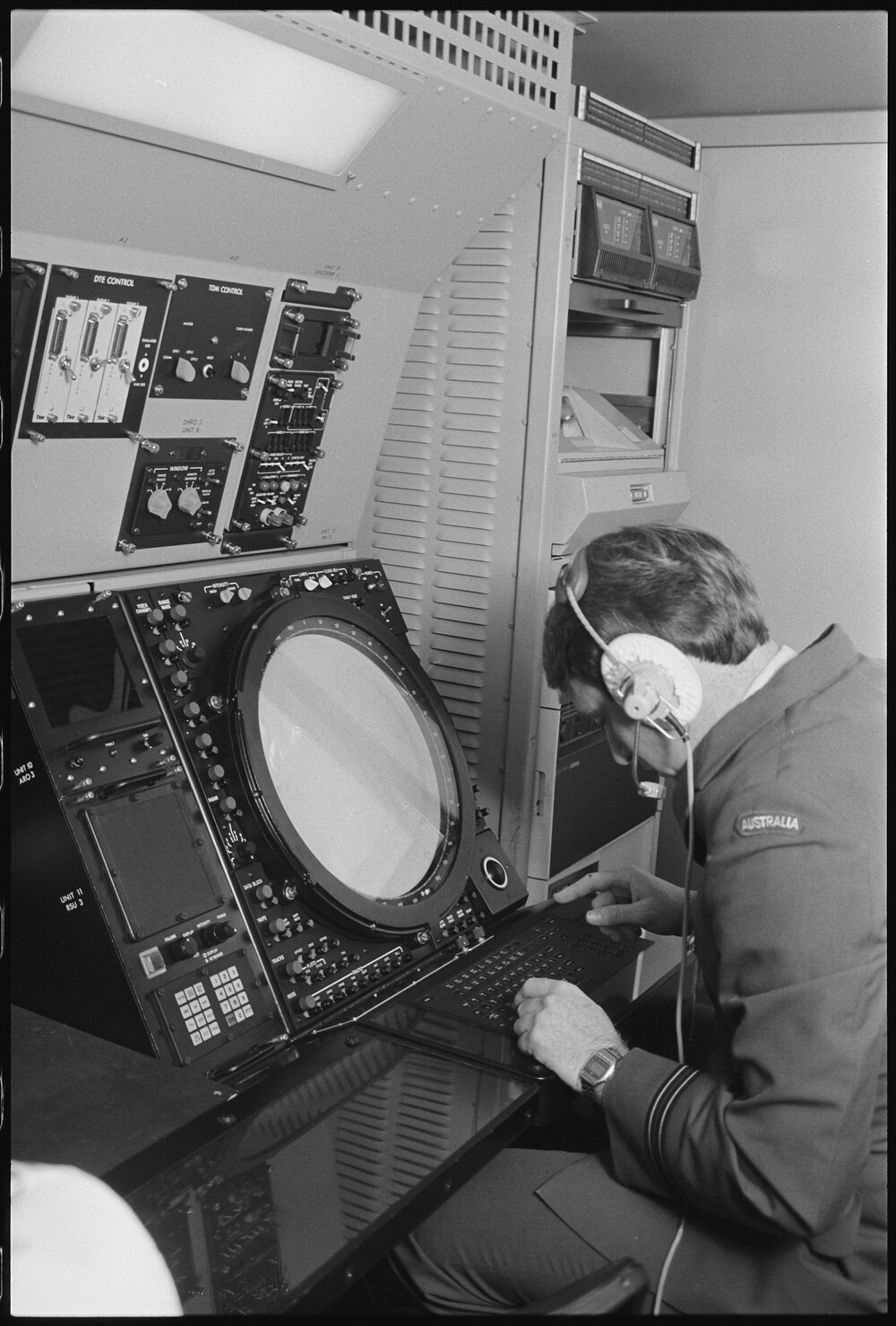 Unidentified RAAF Airman operating a control board, Ipswich, July 1985