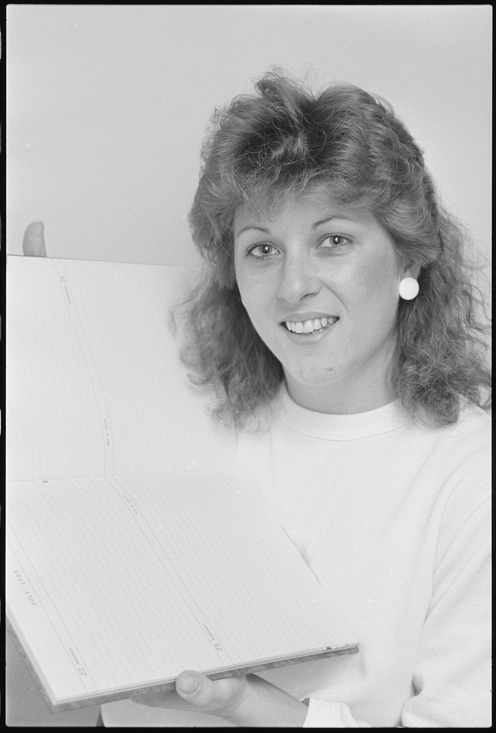 Unidentified lady holding a diary dated July 1985, Ipswich, July 1985