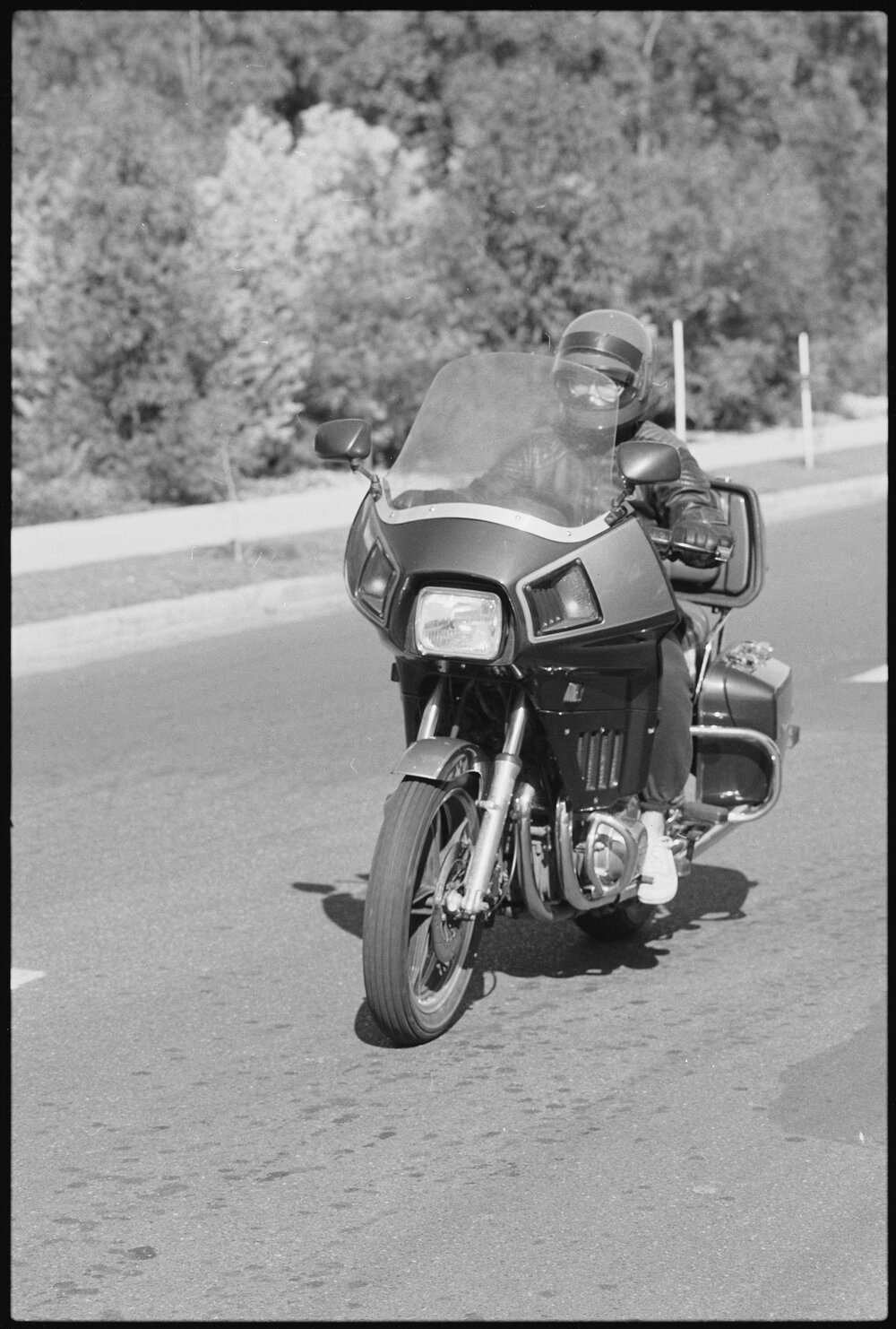 Unidentified bike ride riding a Suzuki GS1100GK past Denmark Hill Water Tower, Ipswich, July 1985