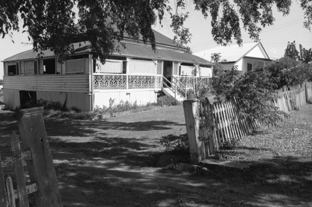 Federation style queenslander with iron railing, Ipswich, November 1977