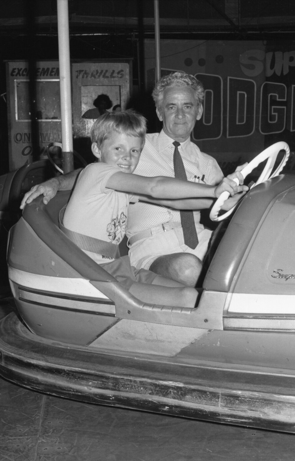 Bouncy castle and bumper cars at a hockey festival, Ipswich, November 1977