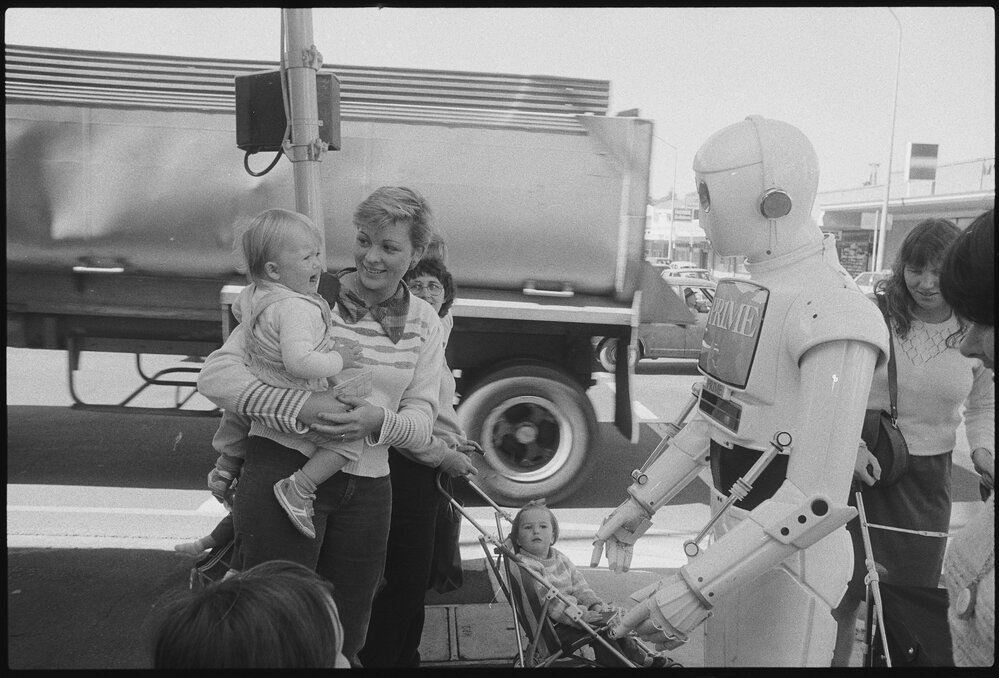 Prime Computer mascot greeting pedestrians outside of Ipswich &amp; West Moreton Building Society, corner East and Limestone Streets, Ipswich, July 1985