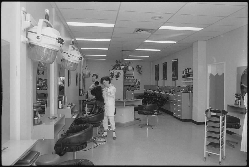 Unidentified hairdressers working at a hair salon, Ipswich, July 1985
