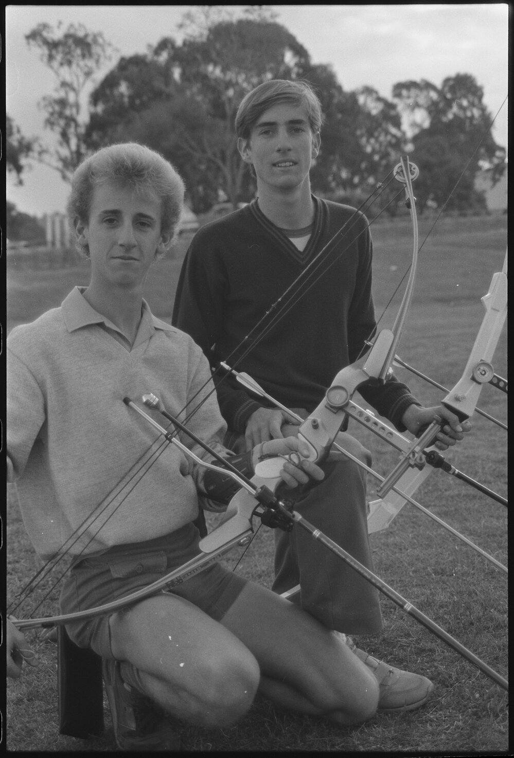 Two young men with archery bows and arrows, Ipswich, July 1985