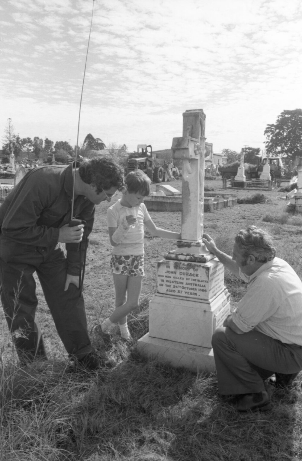 Two men and a boy read John Durack's memorial during Ipswich General Cemetery 'Clean-Up' campaign, Ipswich, 18th June 1977
