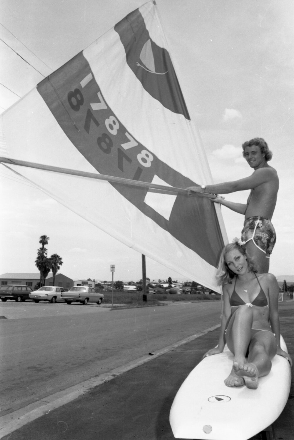 Models on a windsurfing board to promote the Prince Alfred Hotel, Ipswich, November 1977