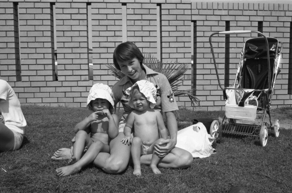 Mother and her children enjoying the sun, Ipswich, November 1977