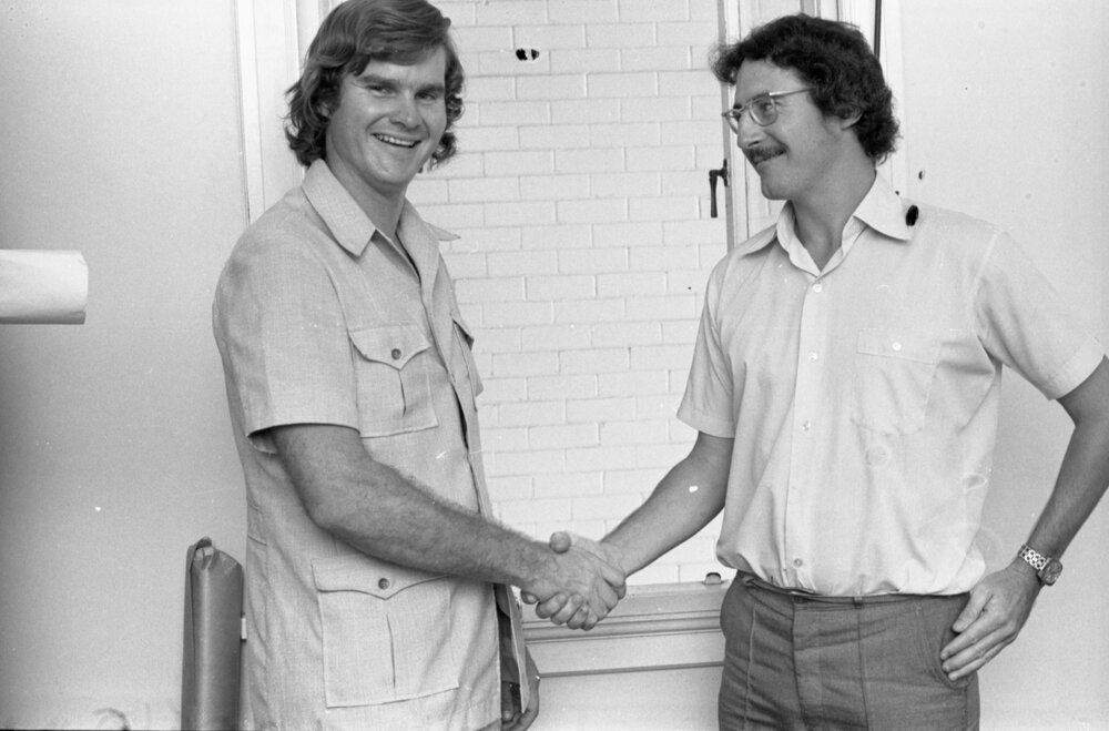 Two unidentified men shaking hands, Ipswich, Queensland, February 1978