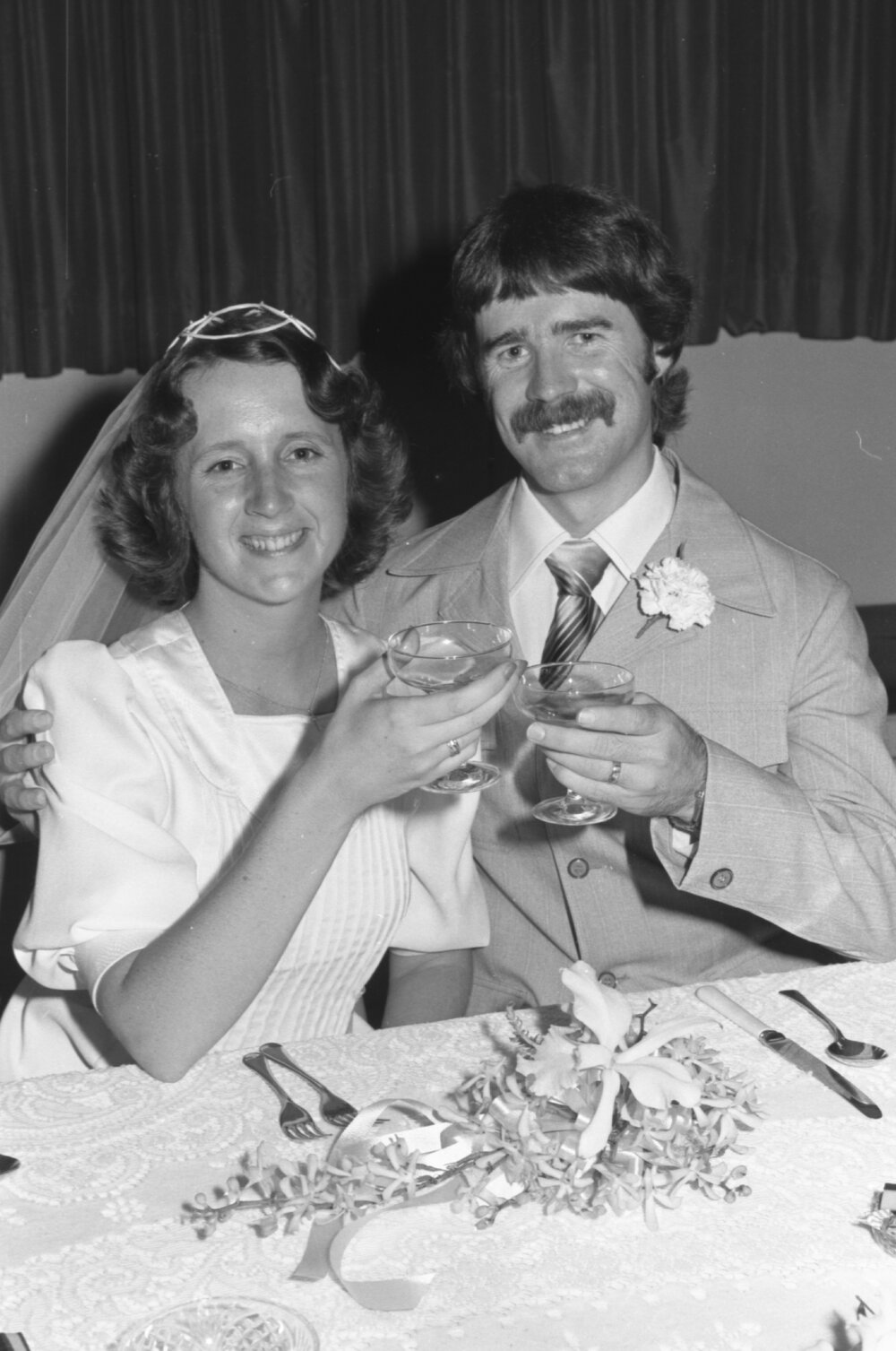 Unidentified newlyweds toasting, Ipswich, Queensland, February 1978