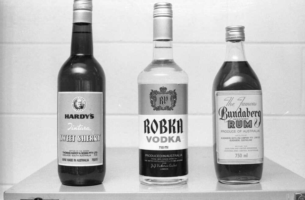 Bottles of Hardy's Sweet Sherry, Robka Vodka, and Bundaberg Rum, photographed for advertisements in the Queensland Times, Ipswich, Queensland, February 1978