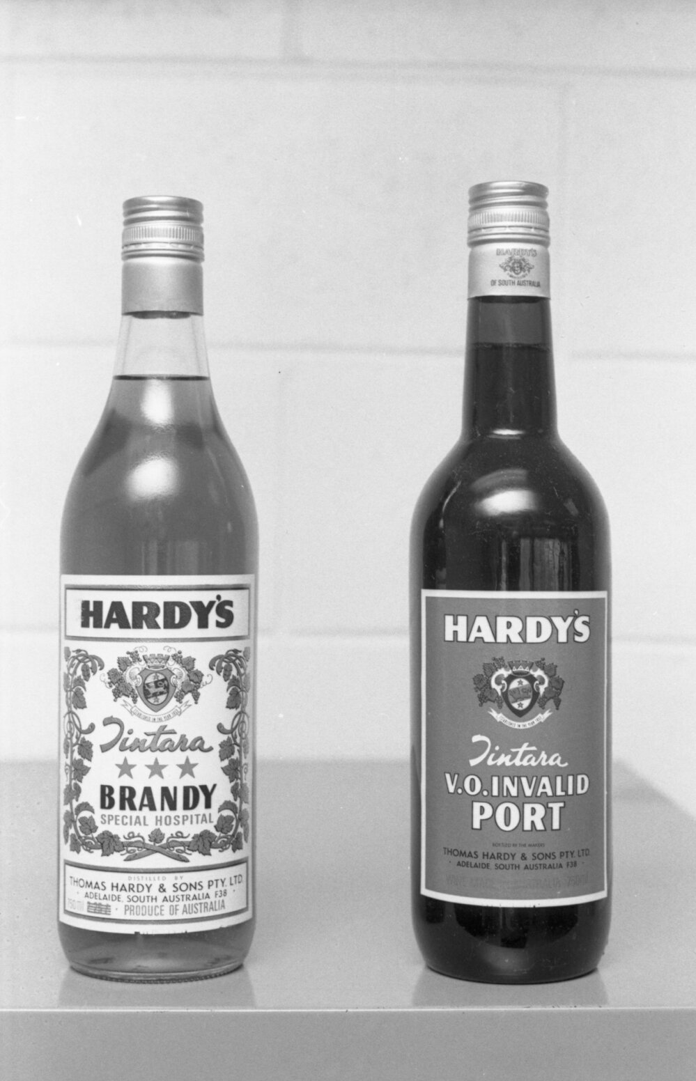 Bottles of Hardy's label port and brandy photographed for advertisements in the Queensland Times, Ipswich, Queensland, February 1978