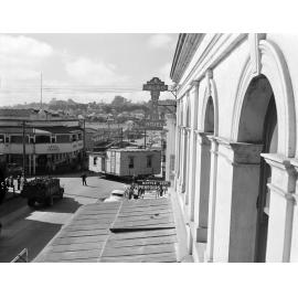 House removal travelling through town, Brisbane Street, Ipswich, 1957