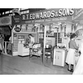 Staff demonstrating electrical appliances at the R T Edwards & Sons electrical appliance display stand at the Ipswich Show, Ipswich, 1957